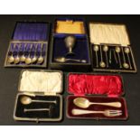 A set of six silver coffee spoons with sugar bows, cased, Birmingham 1923; a set of six Apostle