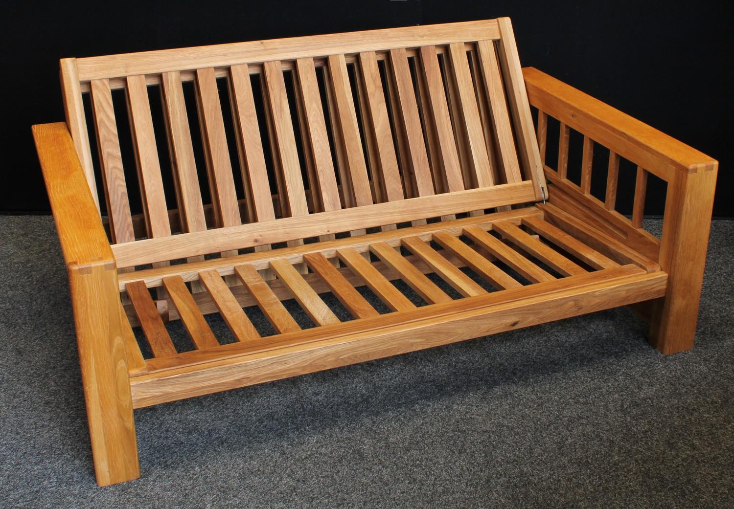 An oak framed sofa bed, Vienna by Futon Company, the frame (in sofa form) 71cm high, 156cm wide, - Image 4 of 6