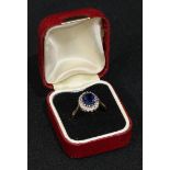 A 9ct gold diamond and sapphire ring