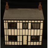 Toys - a 20th century built two storey dolls house, mock Tudor facade in black and white, the