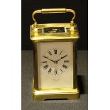 A 20th century brass carriage clock, the white dial with Roman numerals, inscribed S Smith and