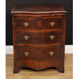 A George III Revival serpentine mahogany crossbanded walnut bachelor's chest, slightly oversailing