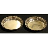 Garrard & Co - a pair of George VI silver counter dishes, of 18th century Irish design, 10cm diam,