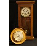 A 20th century wall clock, 8 day movement, 60.5cm high; a circular aneroid barometer (2)