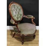 A Victorian walnut boudoir chair, oval back with scrolling foliate cresting, deep-button back, bowed