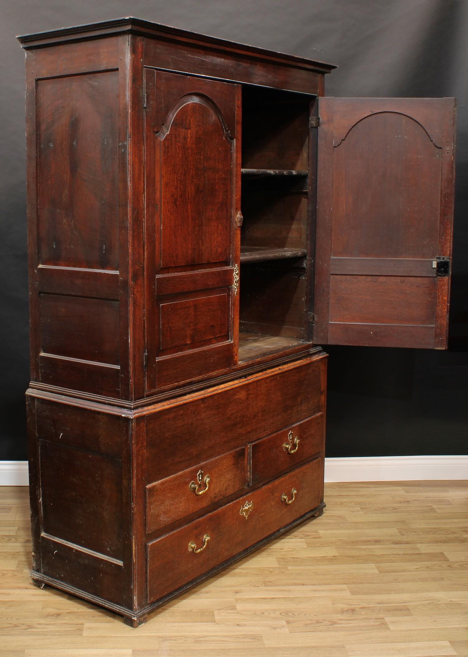 A George III oak housekeeper's or press cupboard, shallow outswept cornice above a pair of raised - Image 7 of 7