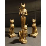 Interior Design - Egyptology, a resin model of a cat god, 39cm; three other resin models of