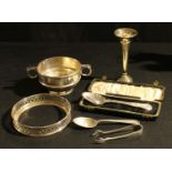 A silver Christening spoon, Dublin 1954, cased; a pair of sugar bows, Sheffield 1929; a silver