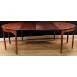 A George III mahogany 'D-end' dining table, slightly oversailing top with two additional leaves,