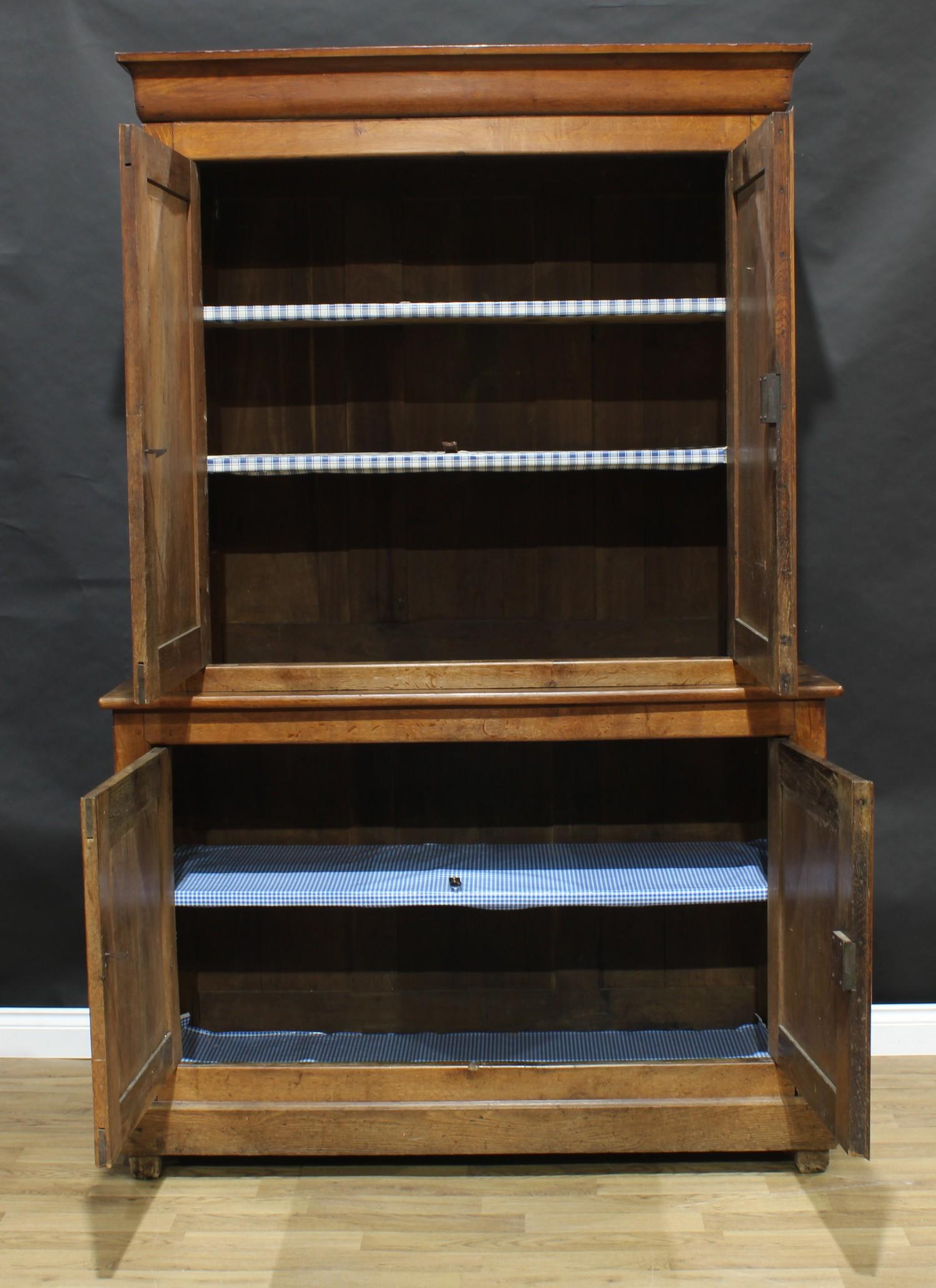 An early 20th century oak housekeeper's cupboard, moulded cornice above a pair of panel doors - Image 2 of 3