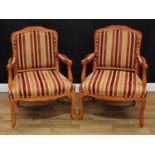 A pair of French Louis XV style armchairs