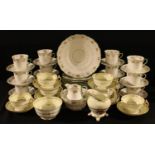 An Edwardian floral banded tea service for twelve comprising cake plate, side plates, cream jug,