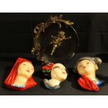 A set of three mid 20th century plaster wall masks; etc (4)