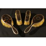 A George V silver and tortoiseshell lady's four-piece dressing table set, Adie Brothers Limited,