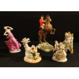 A Beswick model of a huntsman on a rearing horse, number 868; a Royal Doulton model, by Thelwell,