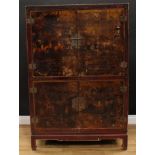 A Chinese inspired painted media cabinet, in the 19th century lacquer taste, decorated in gilt and