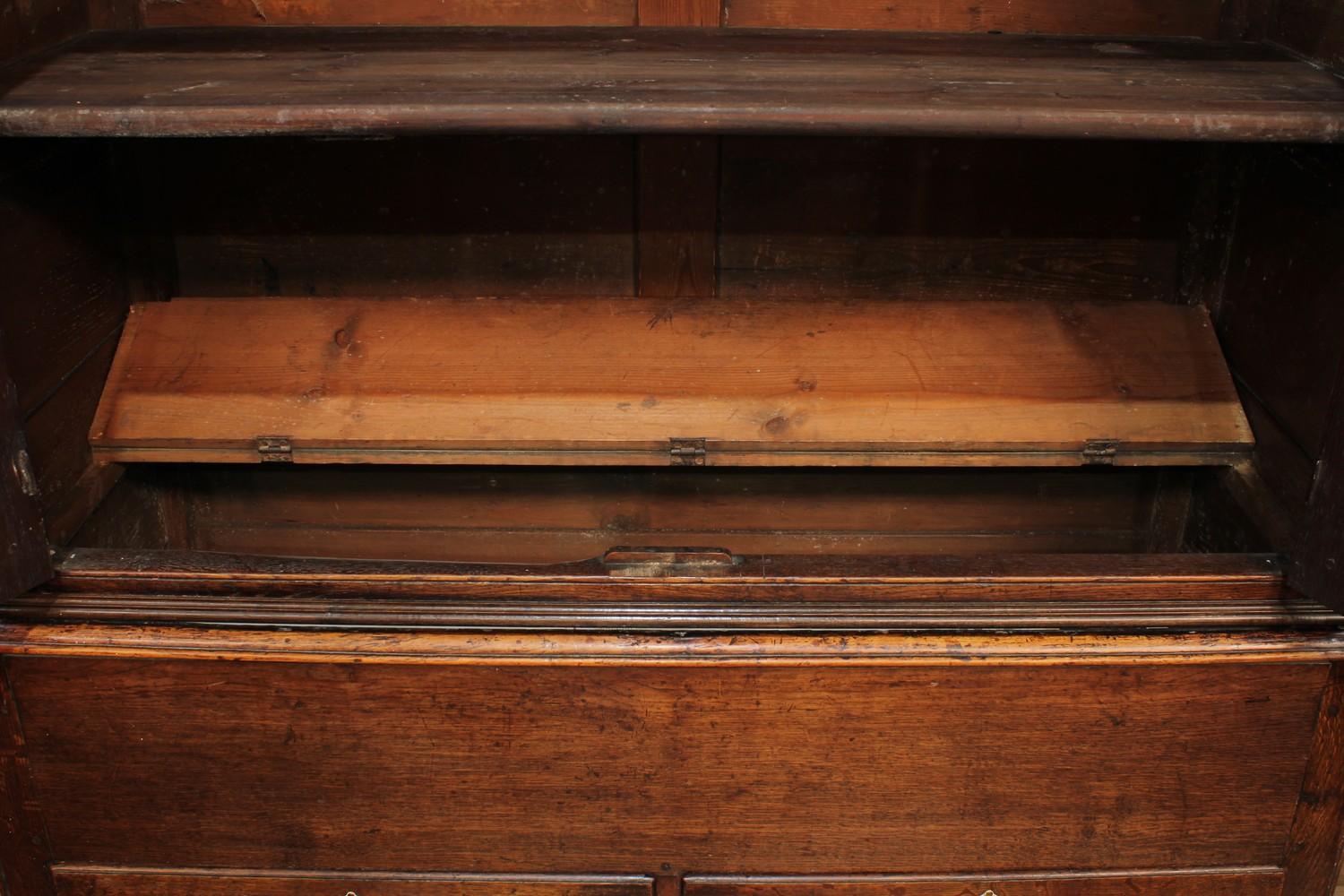 A George III oak housekeeper's or press cupboard, shallow outswept cornice above a pair of raised - Image 4 of 7