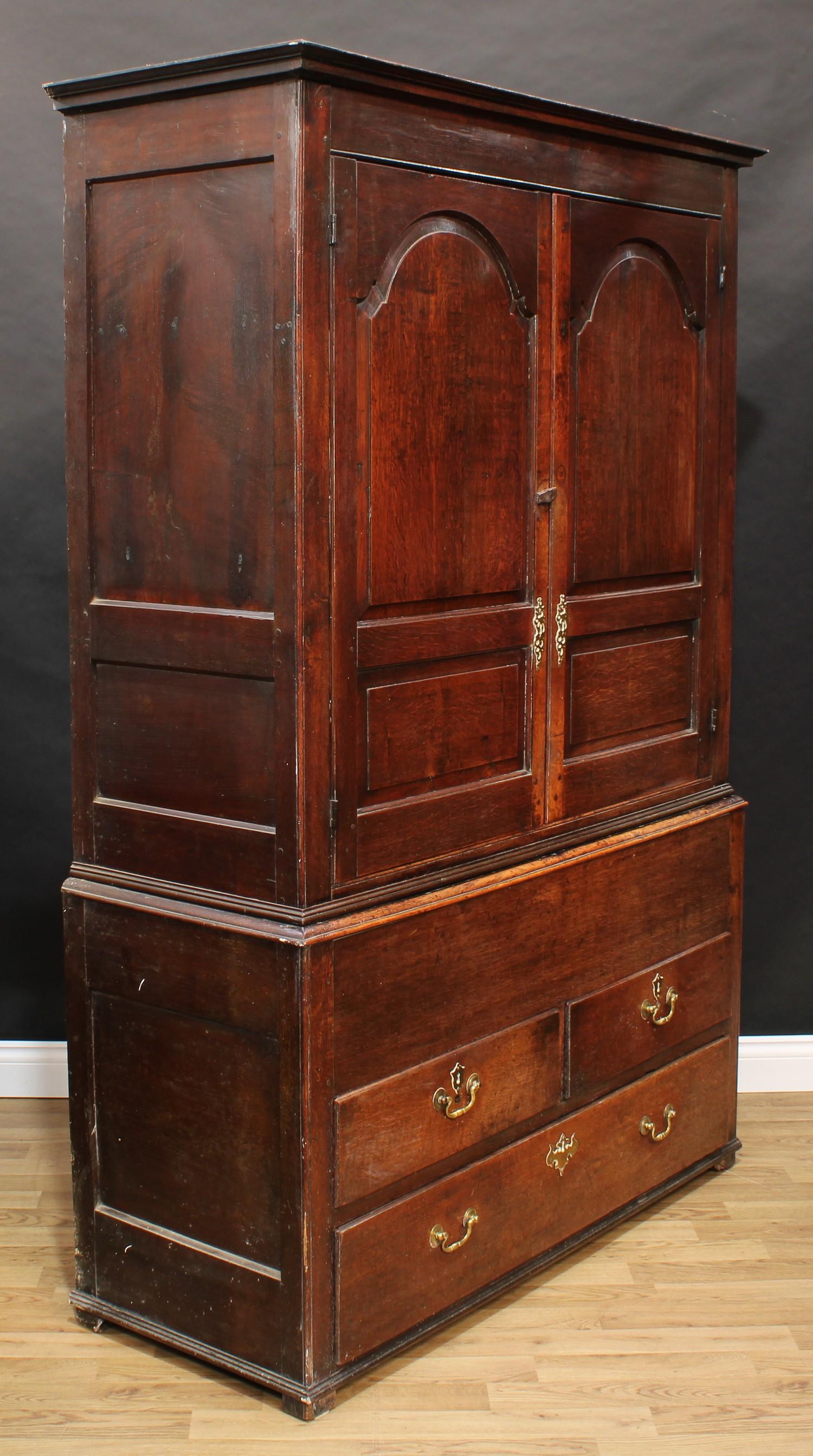 A George III oak housekeeper's or press cupboard, shallow outswept cornice above a pair of raised - Image 5 of 7