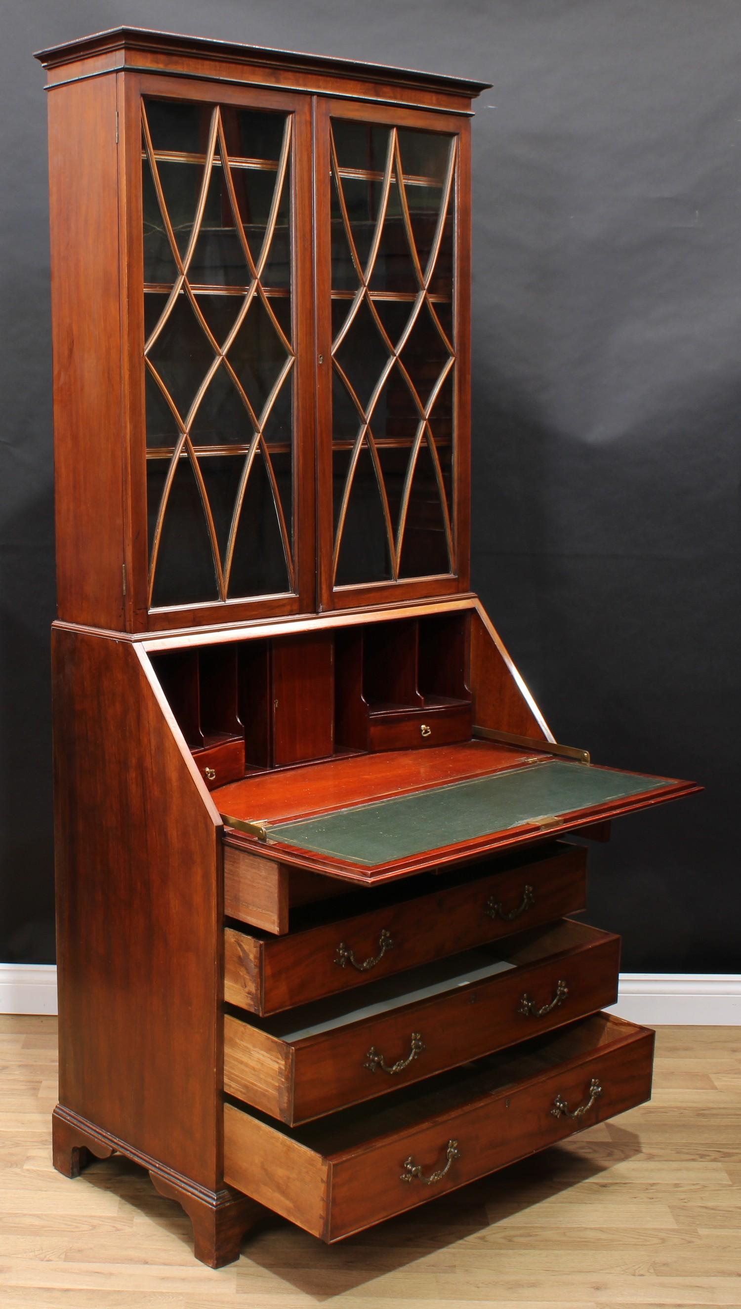 A George III Revival mahogany bureau bookcase, shallow outswept cornice above a pair of glazed doors - Image 4 of 5