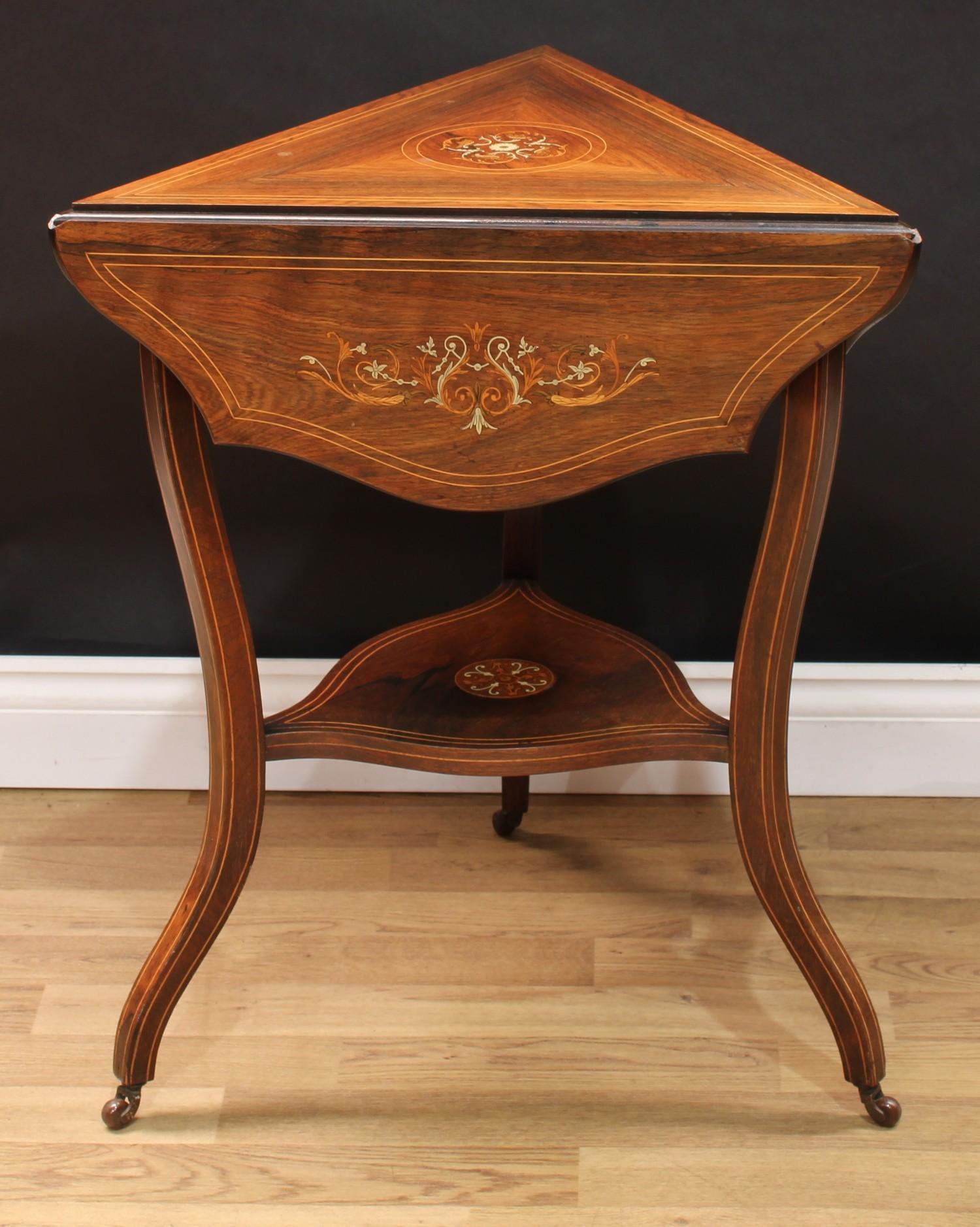 A Sheraton Revival rosewood and marquetry centre table, serpentine circular top with three fall