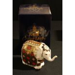 A Royal Crown Derby paperweight, Elephant, 1128 pattern, trunk raised, gold stopper, first