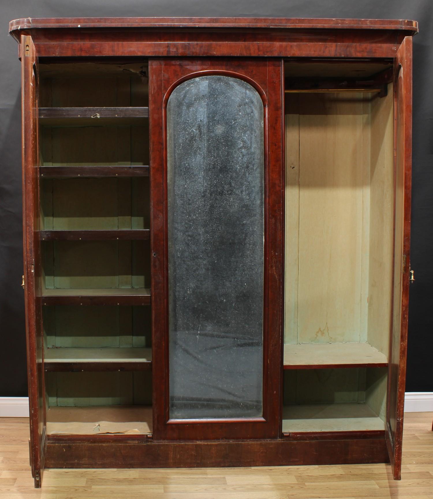 A Victorian mahogany two-door wardrobe, re-purposed from a three-door, outswept cornice above a pair - Image 2 of 2