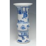 A Chinese gu-shaped beaker vase, painted in underglaze blue with an attended official in a