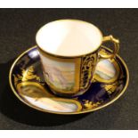 A Continental porcelain cabinet cup and saucer, painted with gentlemen on horseback and coastal