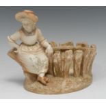 A Royal Worcester figural basket, modelled by James Hadley, signed in the maquette, of a country
