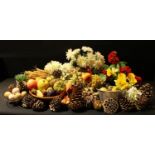 A quantity of artificial fruit and flowers, for home decor or shop display; pine cones, etc