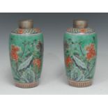 A pair of Chinese famille verte porcelain tapering baluster vases, painted with peonies, cherry