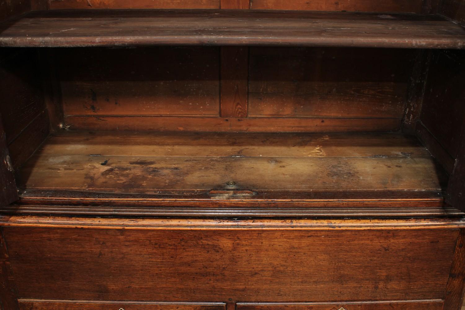 A George III oak housekeeper's or press cupboard, shallow outswept cornice above a pair of raised - Image 3 of 7