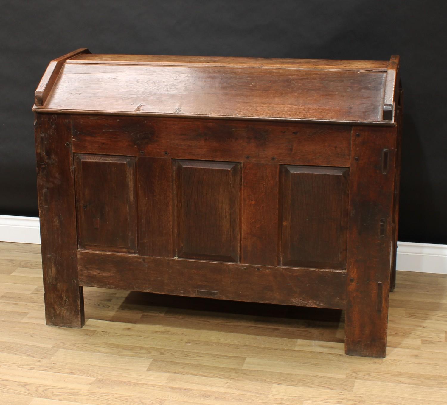 An 18th century oak ark, gabled top, the front with three raised and fielded panels, stile feet, - Image 3 of 3