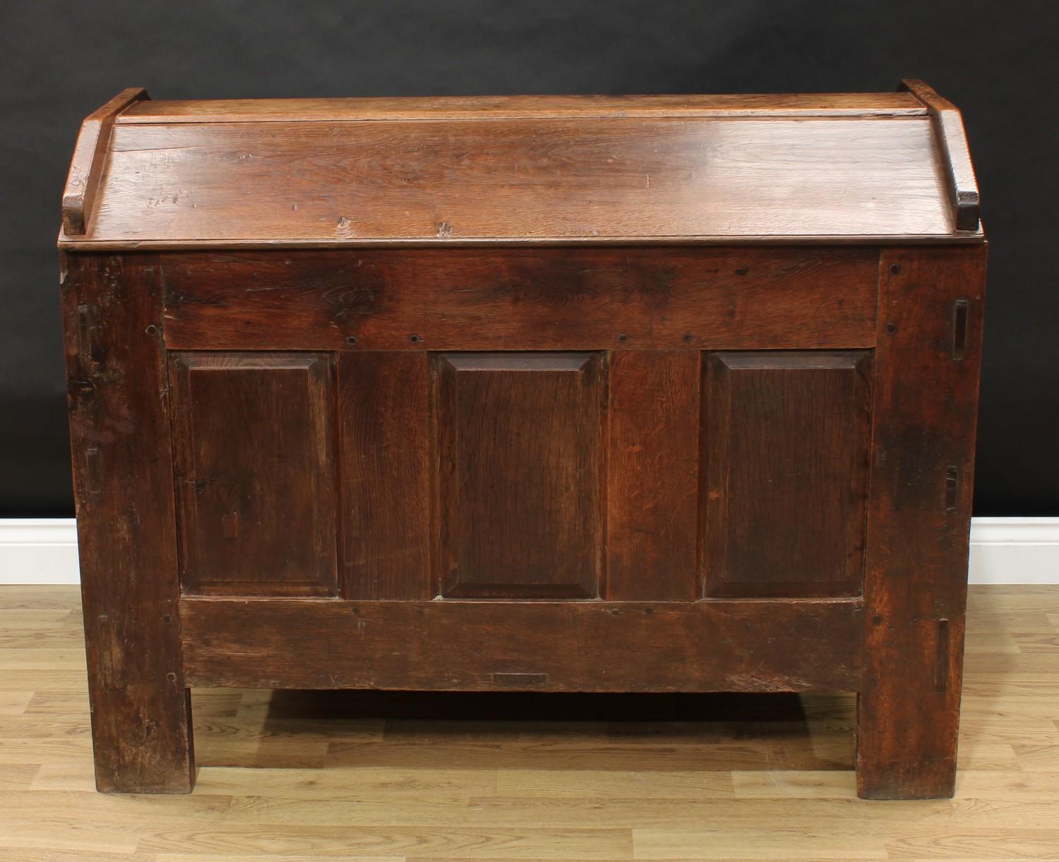 An 18th century oak ark, gabled top, the front with three raised and fielded panels, stile feet,