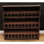 An 18th century Continental country house spice or plate rack, of peg-and-joint construction,