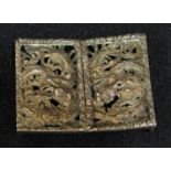 A 19th century Chinese silver dragon buckle