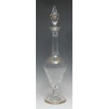 A Moser glass ogee pedestal decanter, cut and etched with roses and leafy stems, below a
