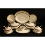 An early 20th century dinner service for twelve comprising dinner plates, dessert plates, side