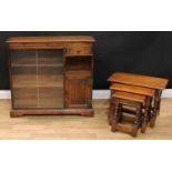 An Old Charm oak bookcase, rectangular top with moulded edge above a pair of sliding glass doors