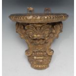 A 19thc century Rococo Revival giltwood and gesso wall bracket, oversailing trefoil top bordered