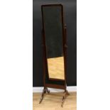 A Regency style mahogany cheval mirror, rectangular frame with re-entrant angles, outswept legs,
