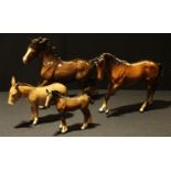 A Beswick model of a shire horse; others, foal, donkey; a Royal Doulton model of a horse (4)