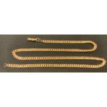 A yellow metal 24" curb chain, unmarked, tests as approx 14ct gold, 57.8g