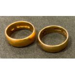 A 22ct gold wedding band, size M, William Manton, Birmingham, 1916 7.8g; another 9ct size P 3.8g (2)