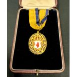 A 22ct gold official jewel pendant, centered with a shield enamelled with the red hand of Ulster