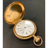 A Elgin National Watch Company hunter cased pocket watch, ornate engraved floral yellow metal