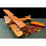 A tropical mahogany model of a Sopwith Camel, chrome fittings 45cm wingspan; a walnut domino set and