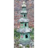 A reconstituted stone Japanese pagoda. 130cm high This lot must be collected from S44 5SU on