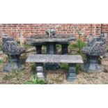 A reconstituted stone Japanese garden table, two chairs, a bench and a curved bench (5). This lot