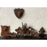 A 19th century Black Forest wall hanging hat/coat hook, carved with a deer, c.1880; etc This lot